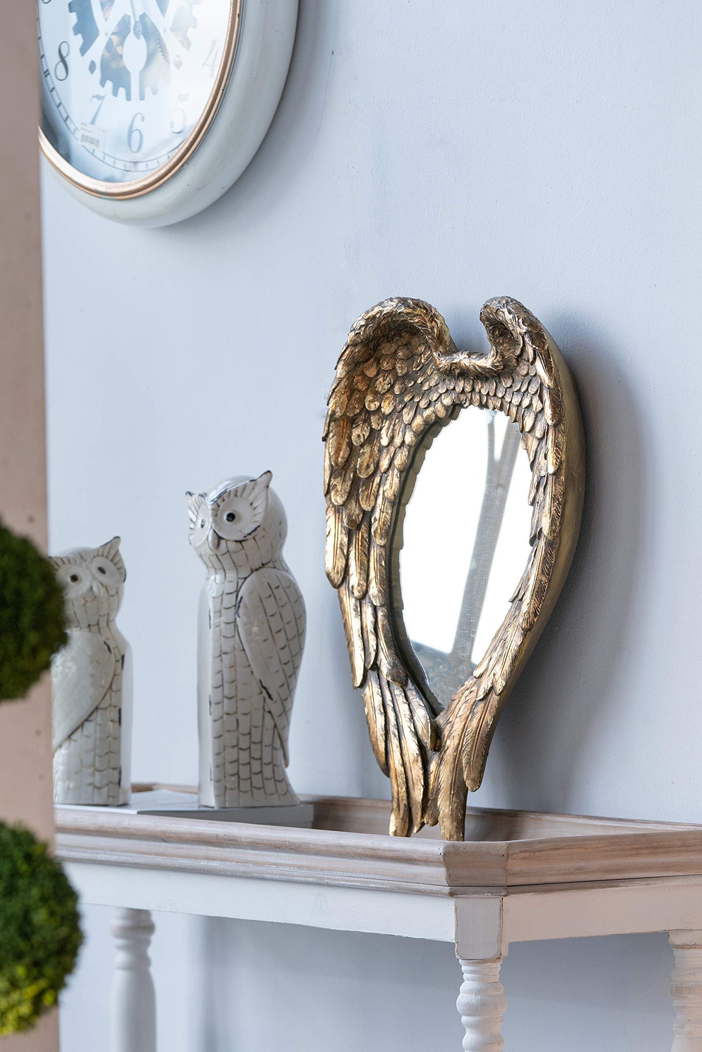 Espejo de pared con detalles de alas para sala de estar - Dorado