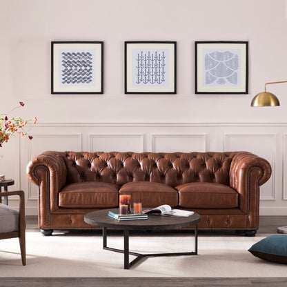 Sofá Chesterfield tradicional de cuero capitoné con diseño de cabeza de clavos