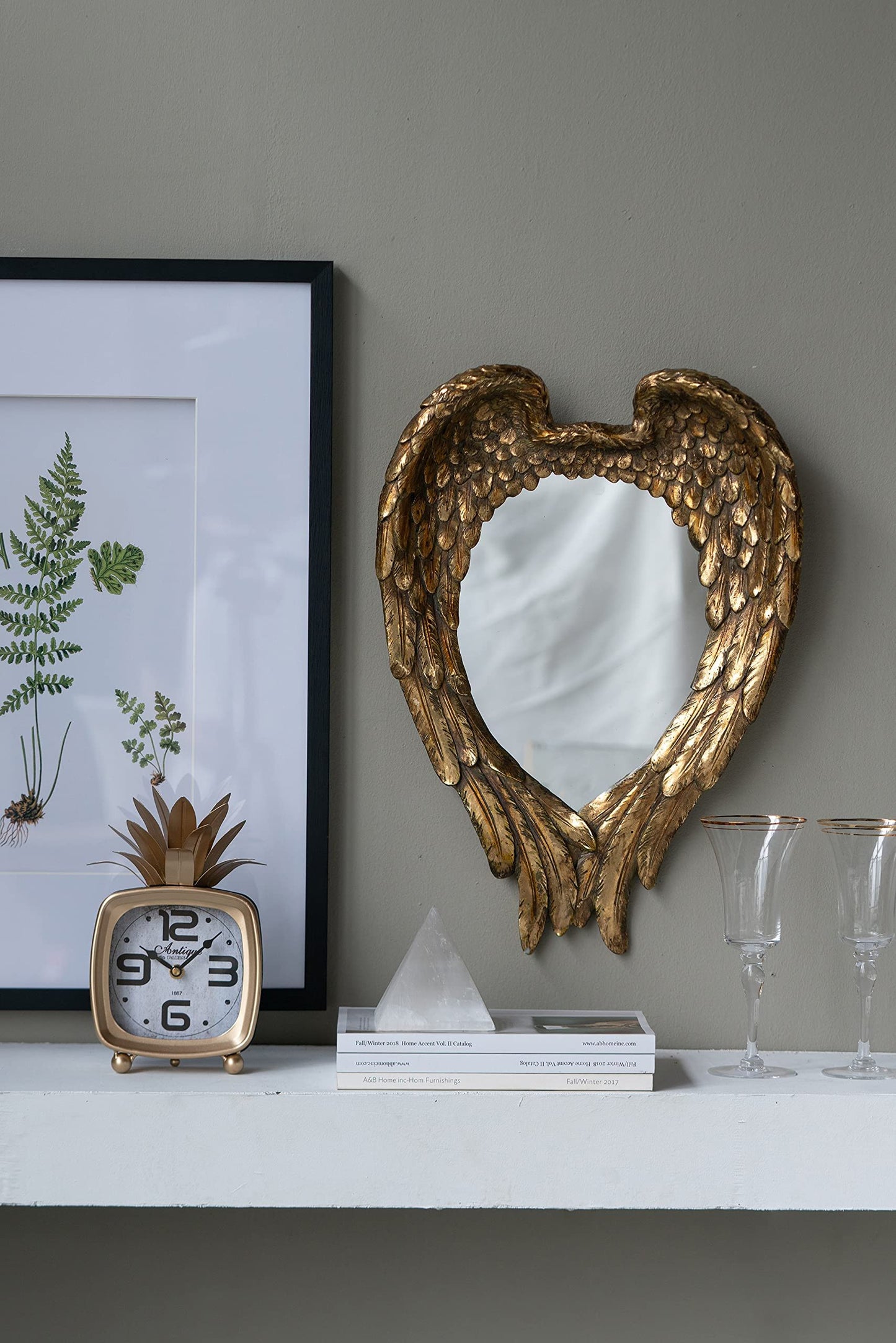 Espejo de pared con detalles de alas para sala de estar - Dorado