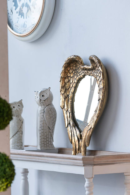 Espejo de pared con detalles de alas para sala de estar - Dorado